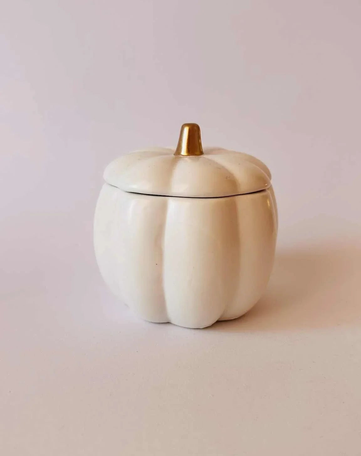 white pumpkin candle